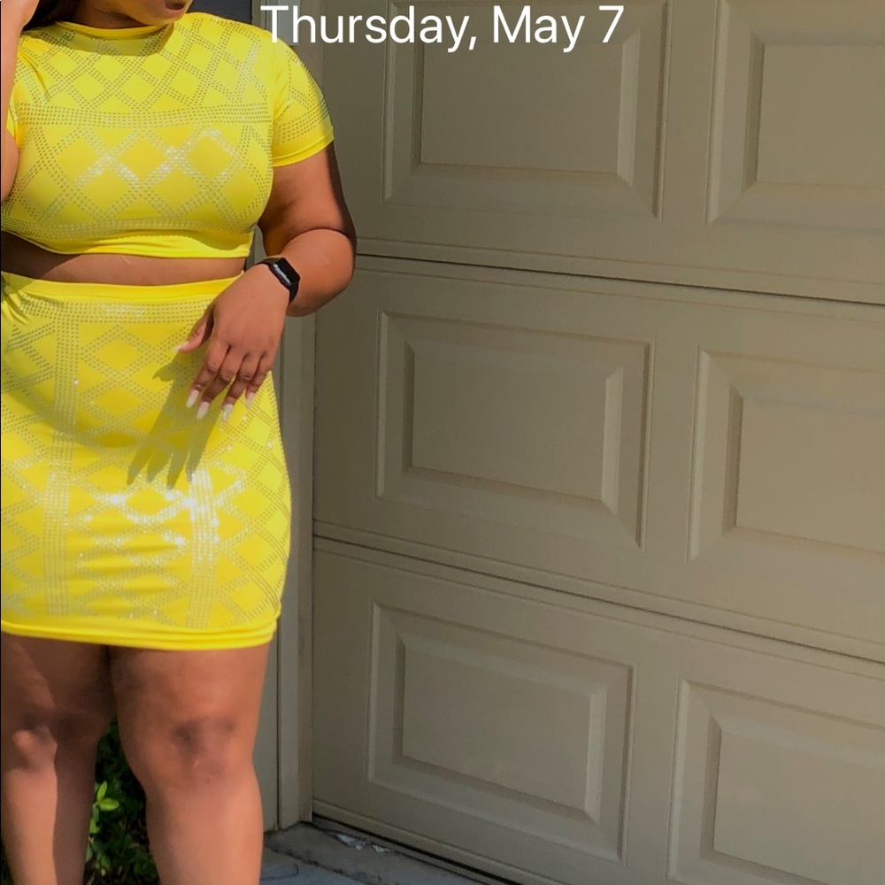 Two piece yellow outfit.
